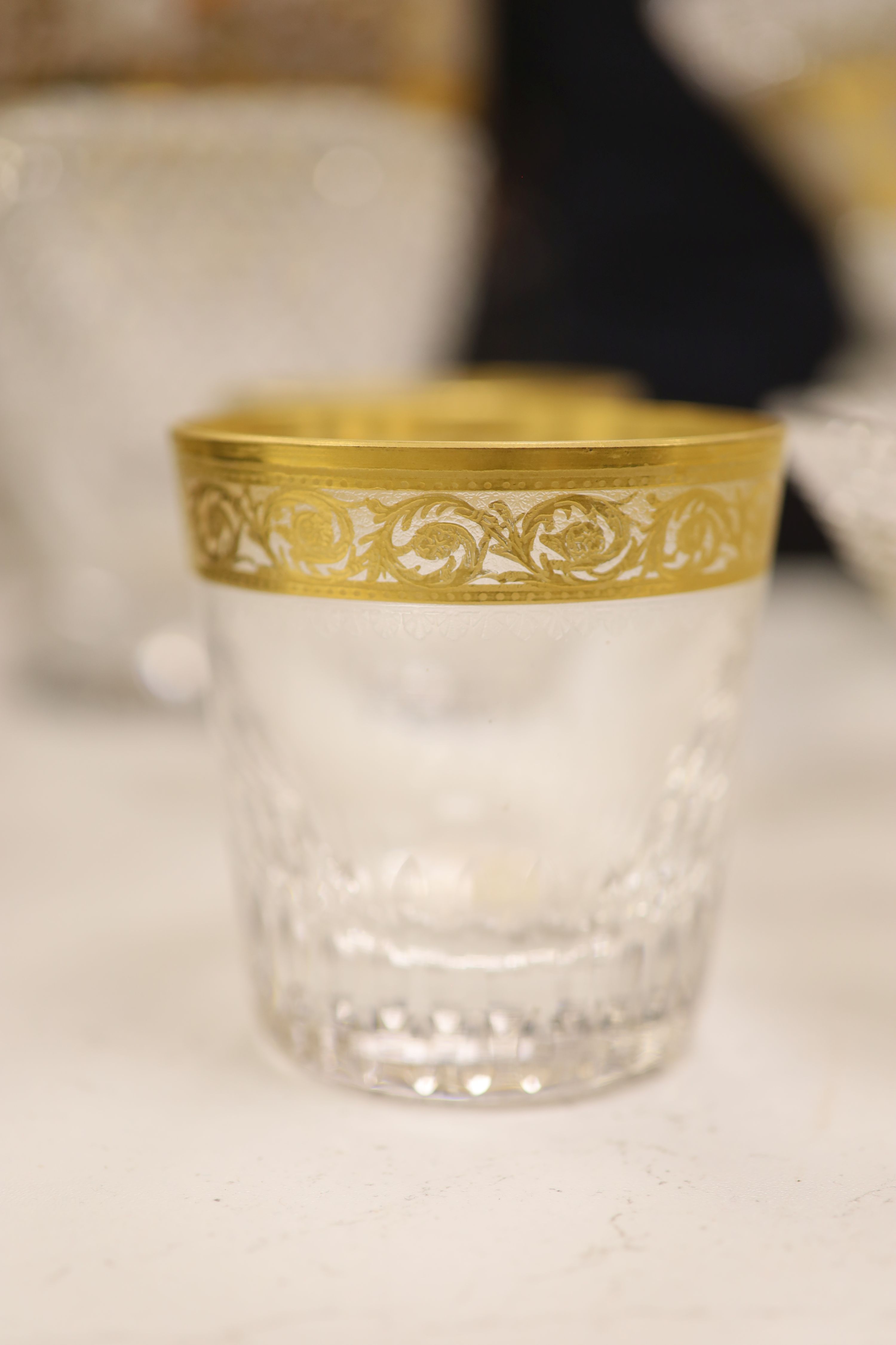 A Moser style tall tapered cut glass vase heightened in gilt, a similar circular bowl, a pedestal bowl and two St Louis tumblers